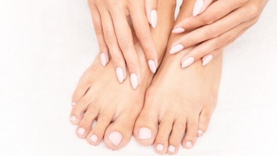 A woman with clean, proper nails after using home remedies for green nails