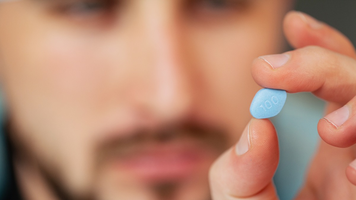 Man holding Viagra