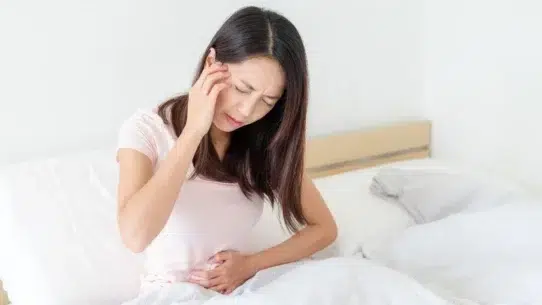 period symptoms vs pregnancy symptoms